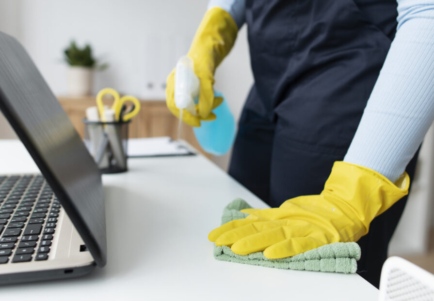person-taking-care-office-cleaning